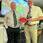 Judge Jim Scott (left) pictured with Patrick Greed (Killerton) Overall Champion Pedigree Herd